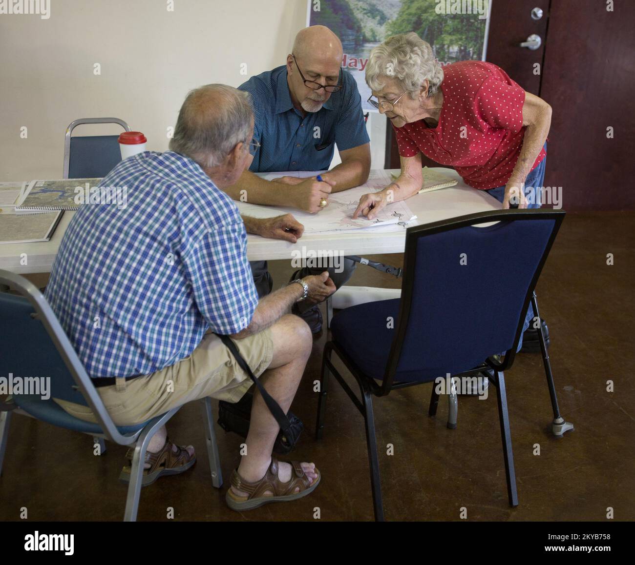 Wimberley, TX, USA August 26, 2015  Wimberley residents Diane and Robert Townsend review county mas with Hays County representative Tom Toe at the Advisory Base Flood Elevation community meeting. Local, State and FEMA representatives were at the meeting to assist and advise homeowners about flood ma updates. Andrea. Texas Severe Storms, Tornadoes, Straight-line Winds, and Flooding. Photographs Relating to Disasters and Emergency Management Programs, Activities, and Officials Stock Photo