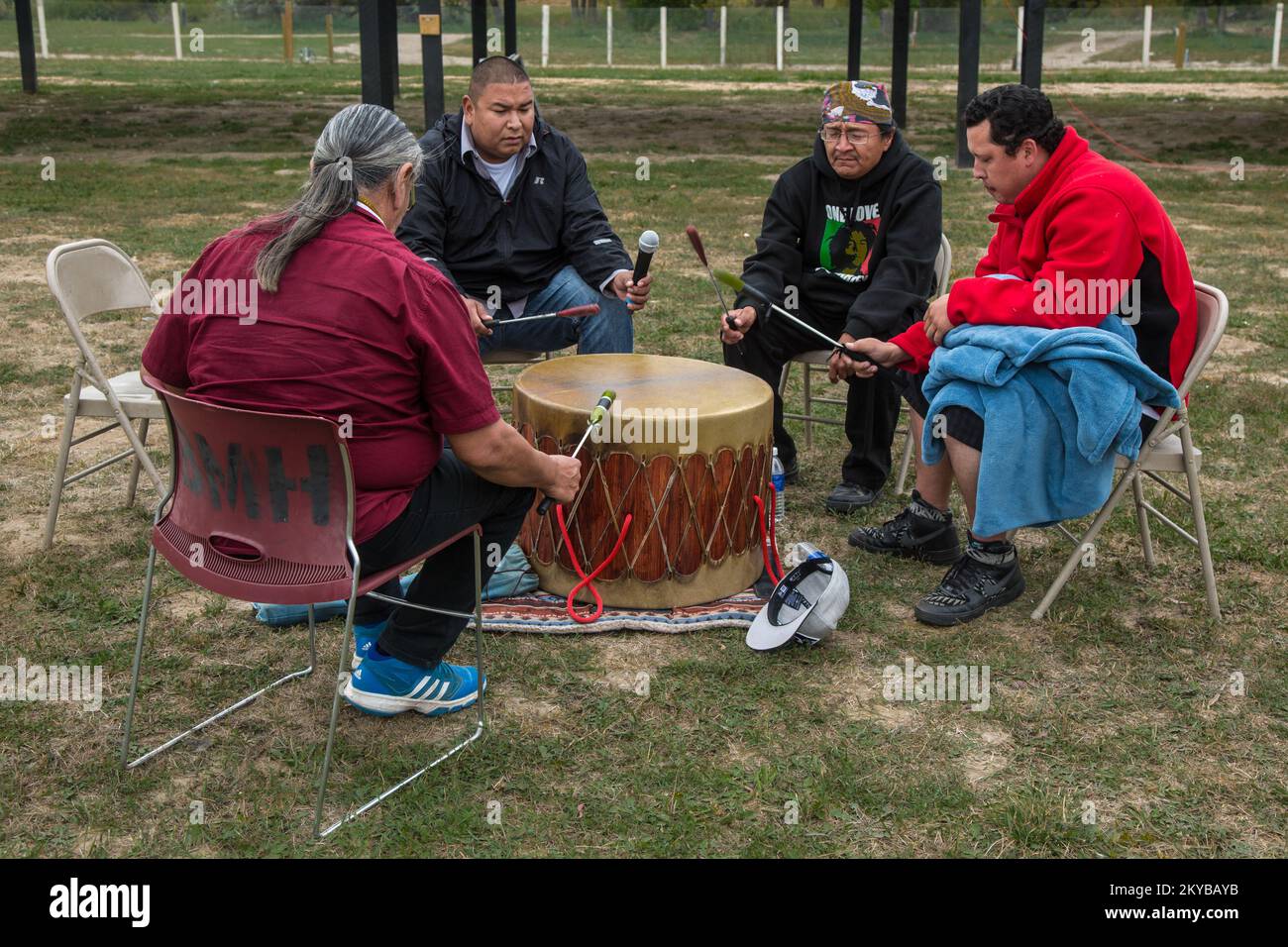 Pine Ridge, SD, September 22, 2015 - Chimney Butte Singers sing a tribal honorary song to start the FEMAOST Tribal Agreement Signing Ceremony at the Oglala Lakota Nation Fair Grounds. The FEMAOST Tribal Agreement was signed by FEMAOST Leadership following a federal disaster declaration on August 7 for severe storms, straight-line winds and flooding that occurred on the Pine Ridge Reservation between May 8 and May 29, 2015. Oglala Sioux Tribe of the Pine Ridge Reservation Severe Storms, Straight-line Winds, and Flooding. Photographs Relating to Disasters and Emergency Management Programs, Activ Stock Photo