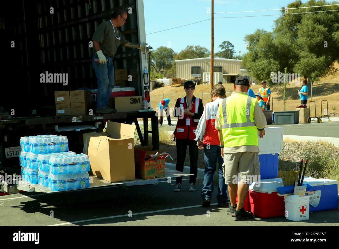 San Andreas, CA September 26, 2015- Red Cross workers distribute critical food, water and ice for disaster survivors who have been affected by the recent wildfires. The President approved Major Disaster Declaration (FEMA-4240-DR-CA) for the state of California as a result of the Butte Fire that began 09122015 and continuing. All counties in the state of California are eligible to apply for assistance under the Hazard Mitigation Grant Program. Adam. California Valley Fire and Butte Fire. Photographs Relating to Disasters and Emergency Management Programs, Activities, and Officials Stock Photo