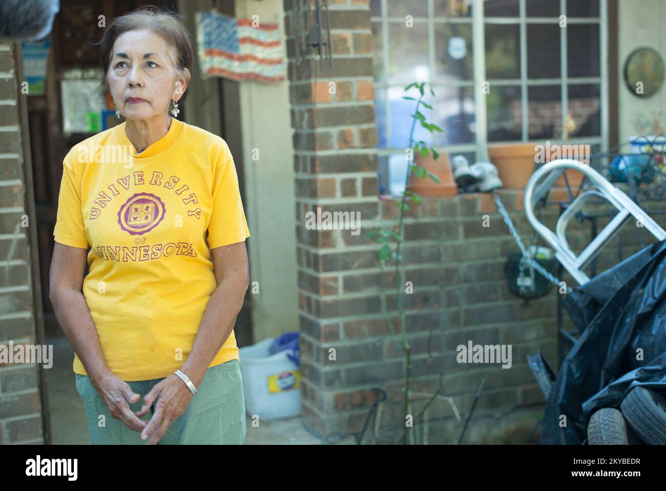 Homeowner Loreta Pastrano stands outside of her flood ravaged house in San Marcos, Texas. The house was gutted and rebuilt by teams of volunteers following the Texas Spring floods.. Texas Severe Storms, Tornadoes, Straight-line Winds, and Flooding. Photographs Relating to Disasters and Emergency Management Programs, Activities, and Officials Stock Photo