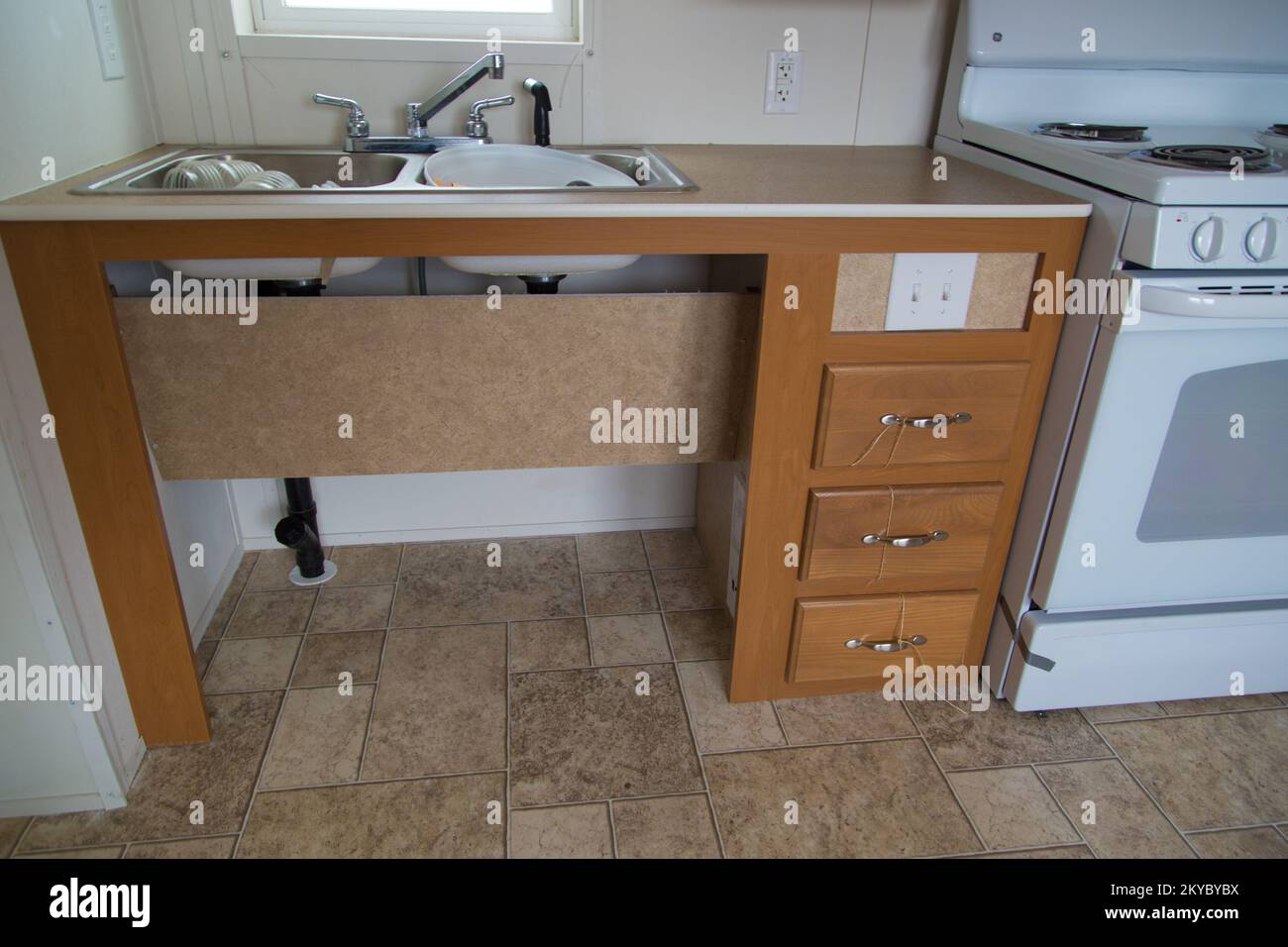 Wheelchair accessible kitchen sink in a Uniform Federal Accessibility