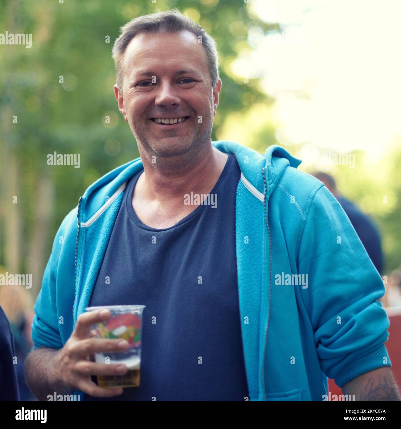 Beer festival time already. A man drinking beer at an outdoor event