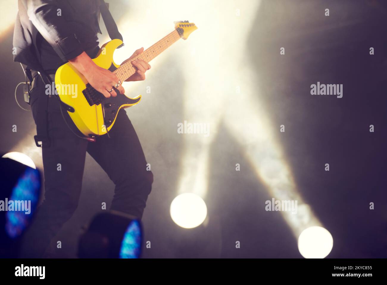 Make those string sing. a musician performing a guitar solo on the stage. Stock Photo