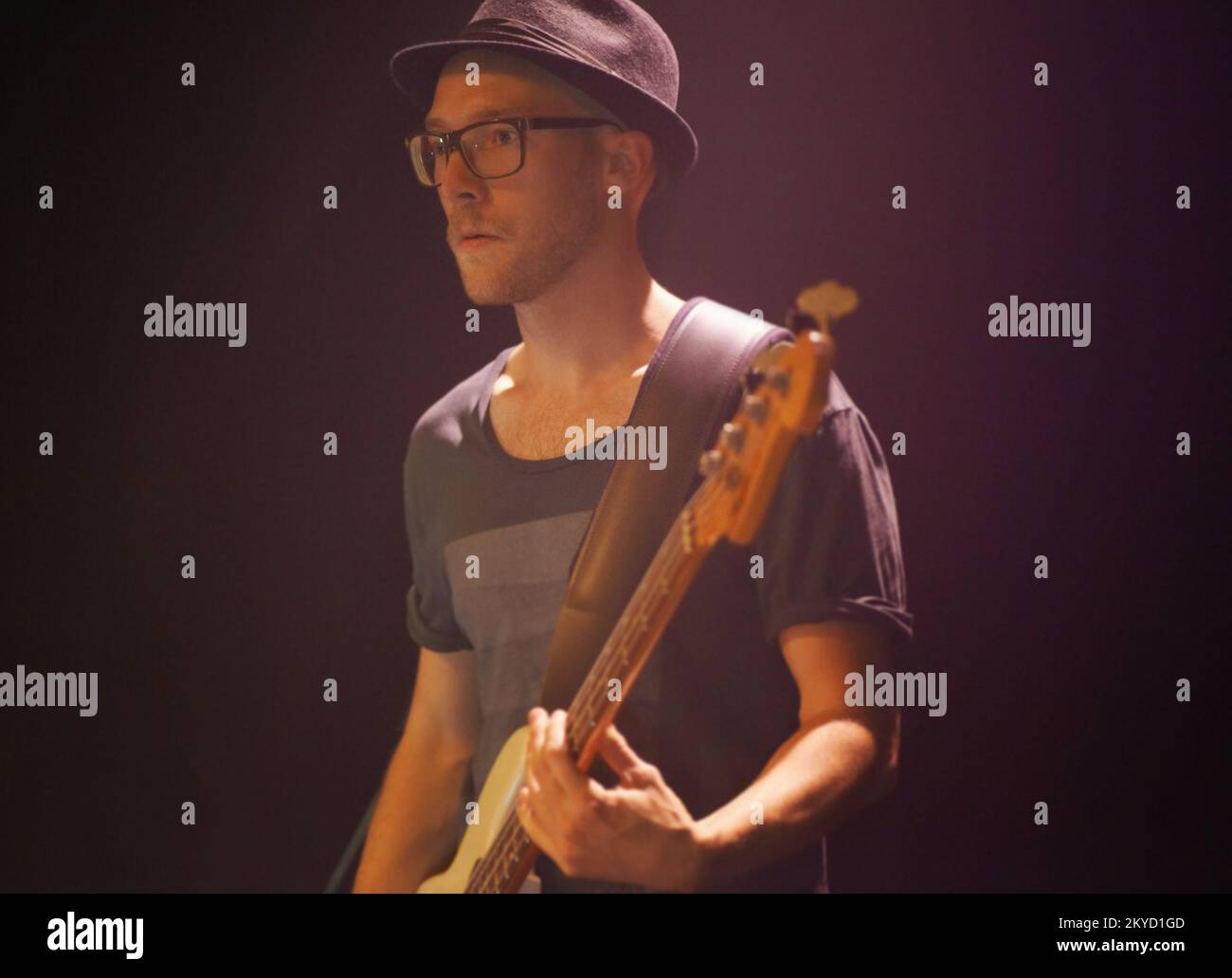 A young guitarist performing on stage. This concert was created for the