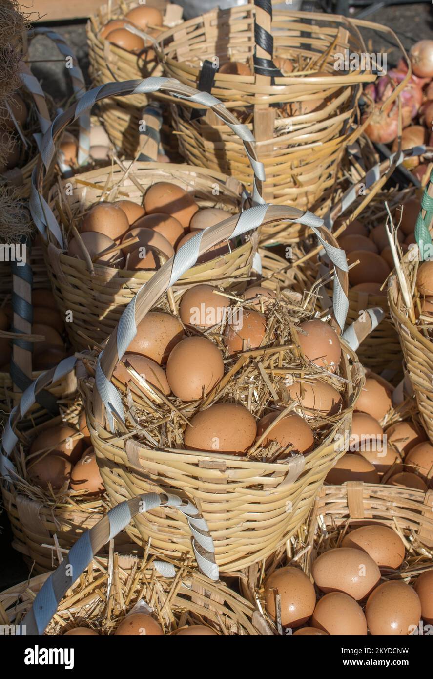 Organic fresh farm eggs in the straw basket Stock Photo - Alamy