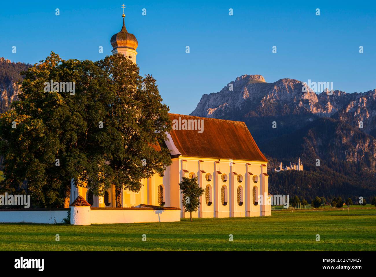 Pilgrimage Church of St. Coloman, behind it Neuschwanstein Castle ...