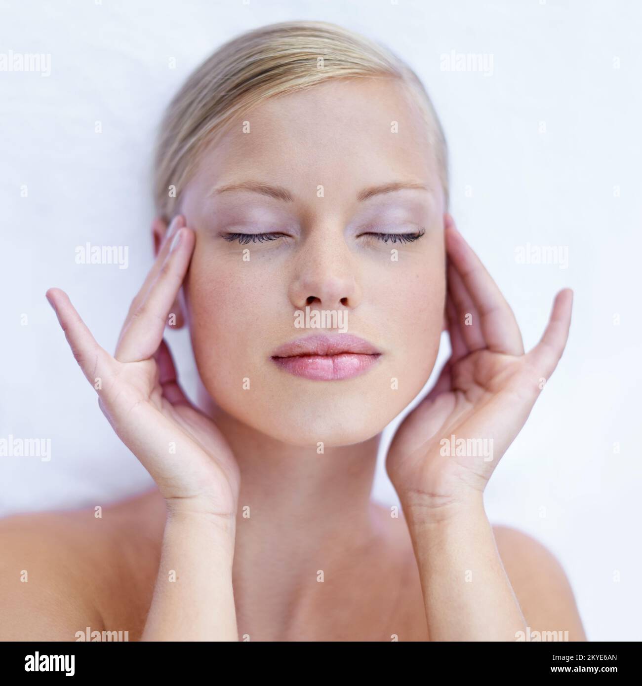 Applying just the right amount of pressure. an attractive young woman