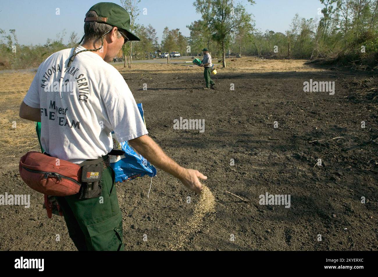 Hurricane Katrina, New Orleans, LA.,10/12/2005--National Park Service ranger, Kevin Kelley, from Michigan, assists with the reseeding at the Bayou Segnette State Park ouside of New Orleans. More than 500 National Park Service emplyees have left their homes to hlp out following Hurricane Katrina. FEMA photo/Andrea Booher Stock Photo