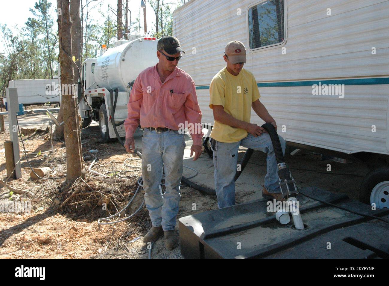 Hurricane Katrina, Hancock County, Miss., October 26, 2005 -- Workers clean the bladder of a travel trailer in McLeod Park. It is important that the FEMA travel trailers are well maintained and kept functioning correctly. Stock Photo