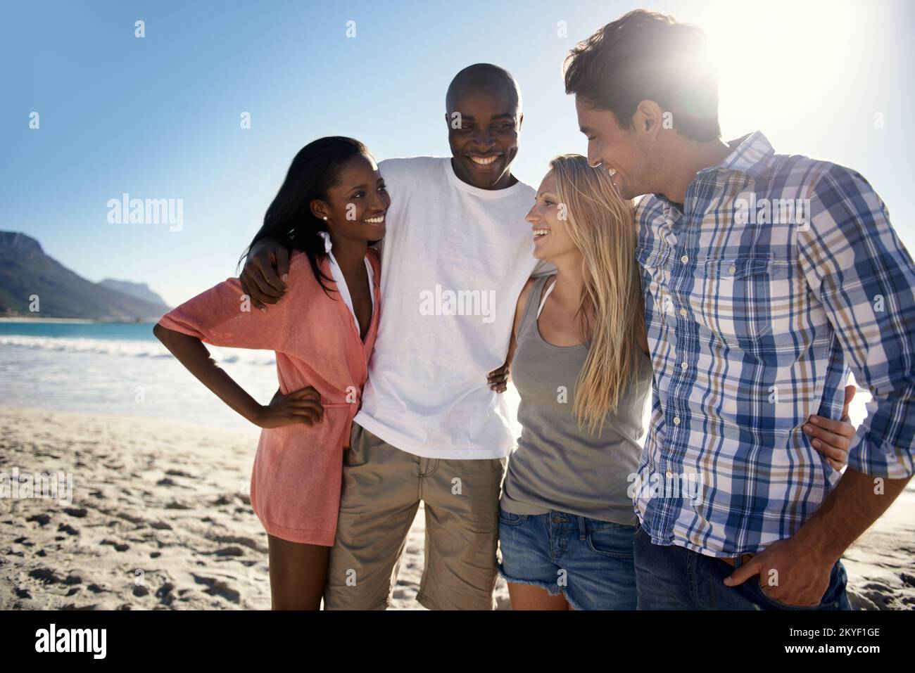 Vacationing with great friends. Cropped view of two young couples
