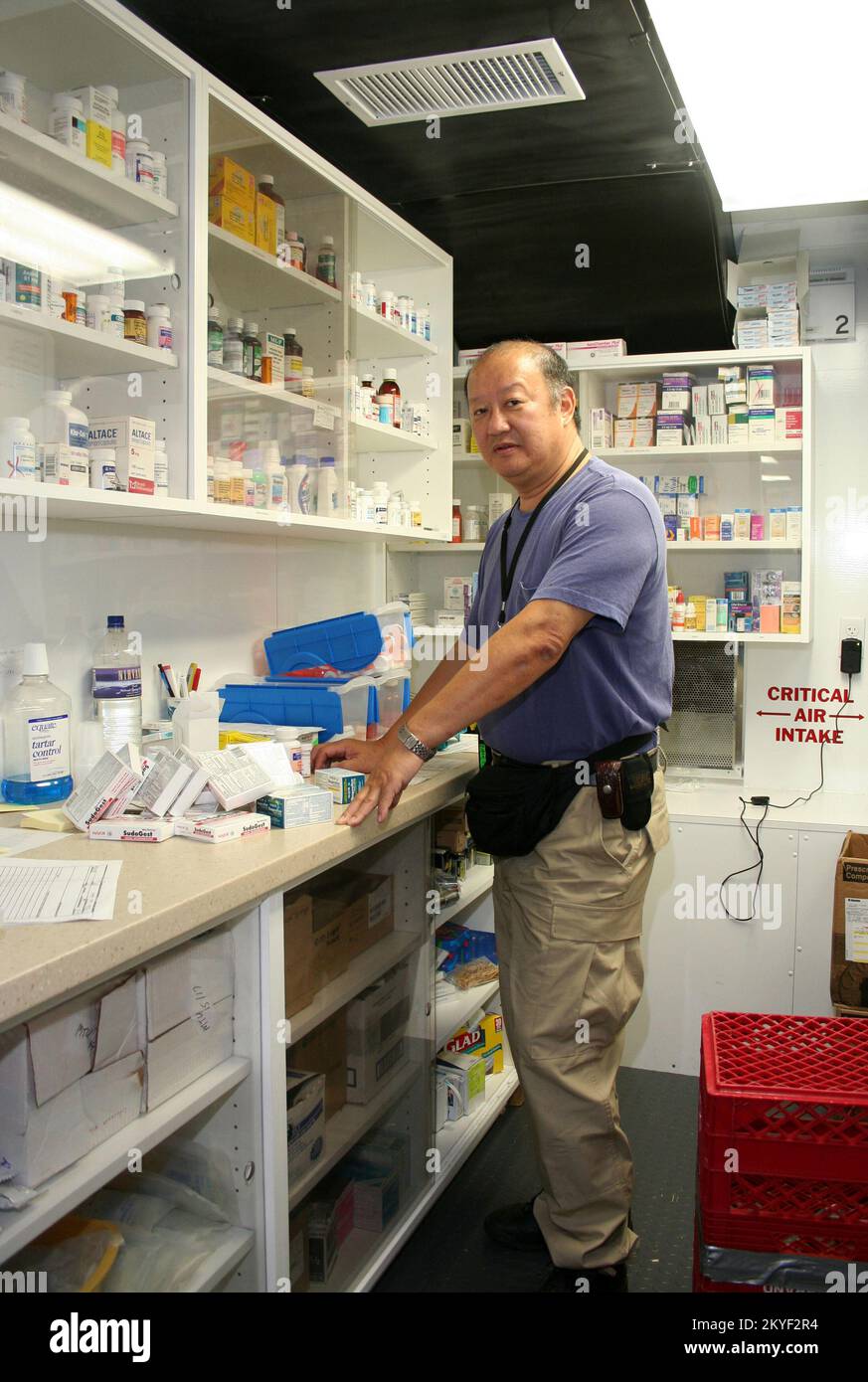 Hurricane Katrina, Plaquemines Parish, LA, November 7, 2005 -- Pharmacist Irwin Chow organized a new shipment of medical supplies in the new and innovative Mobile Medical Unit FEMA set up in the hurricane-ravaged area of soutern Louisiana. Local residents who lost access to medical care can get comprehensive treatment at the MMU. Stock Photo