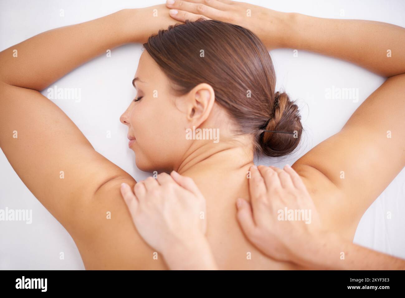 Blissful pampering. A young woman lying in a health spa getting pampered. Stock Photo