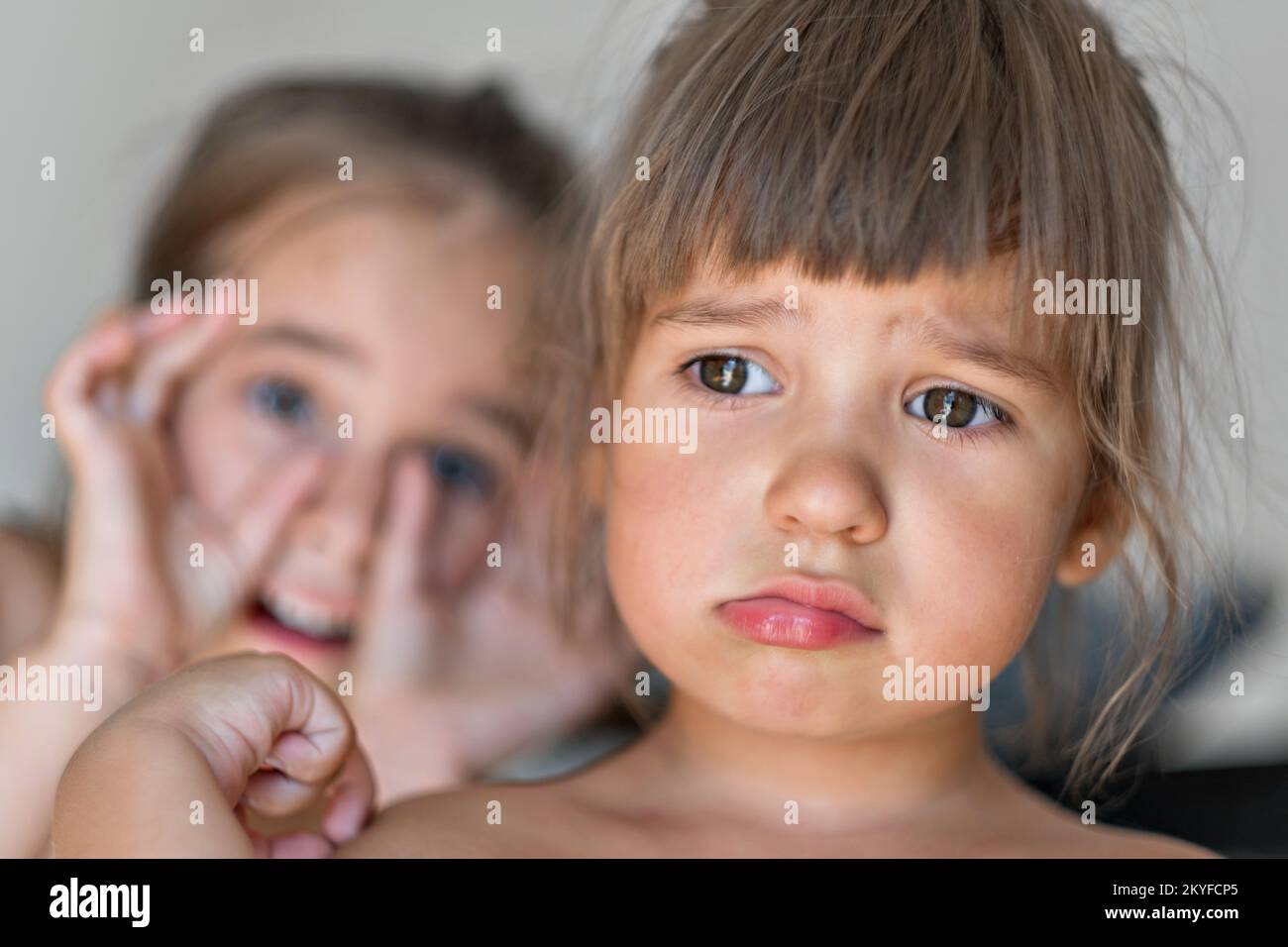 European girl is sad and offended. Sisters quarrel. Sad and sad child. High quality photo. Stock Photo