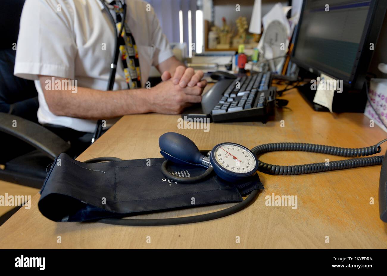 File photo dated 10/09/14 of a GP at their desk, as people are getting sicker owing to decades of spending cuts, 'decimated' public services and the current cost-of-living crisis, doctors have warned. Stock Photo