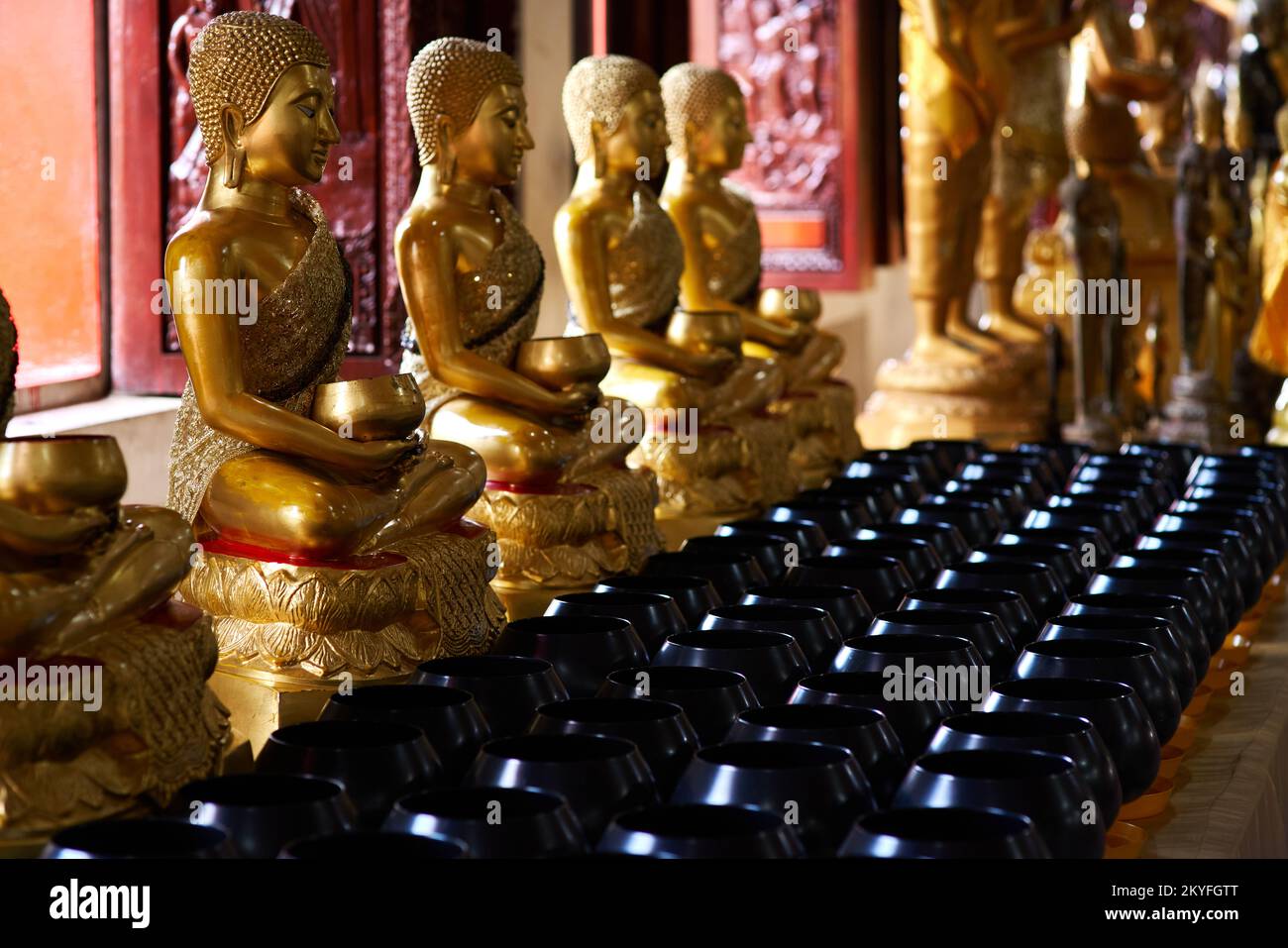 golden buddha statues in Thai Buddhist temple Stock Photo - Alamy