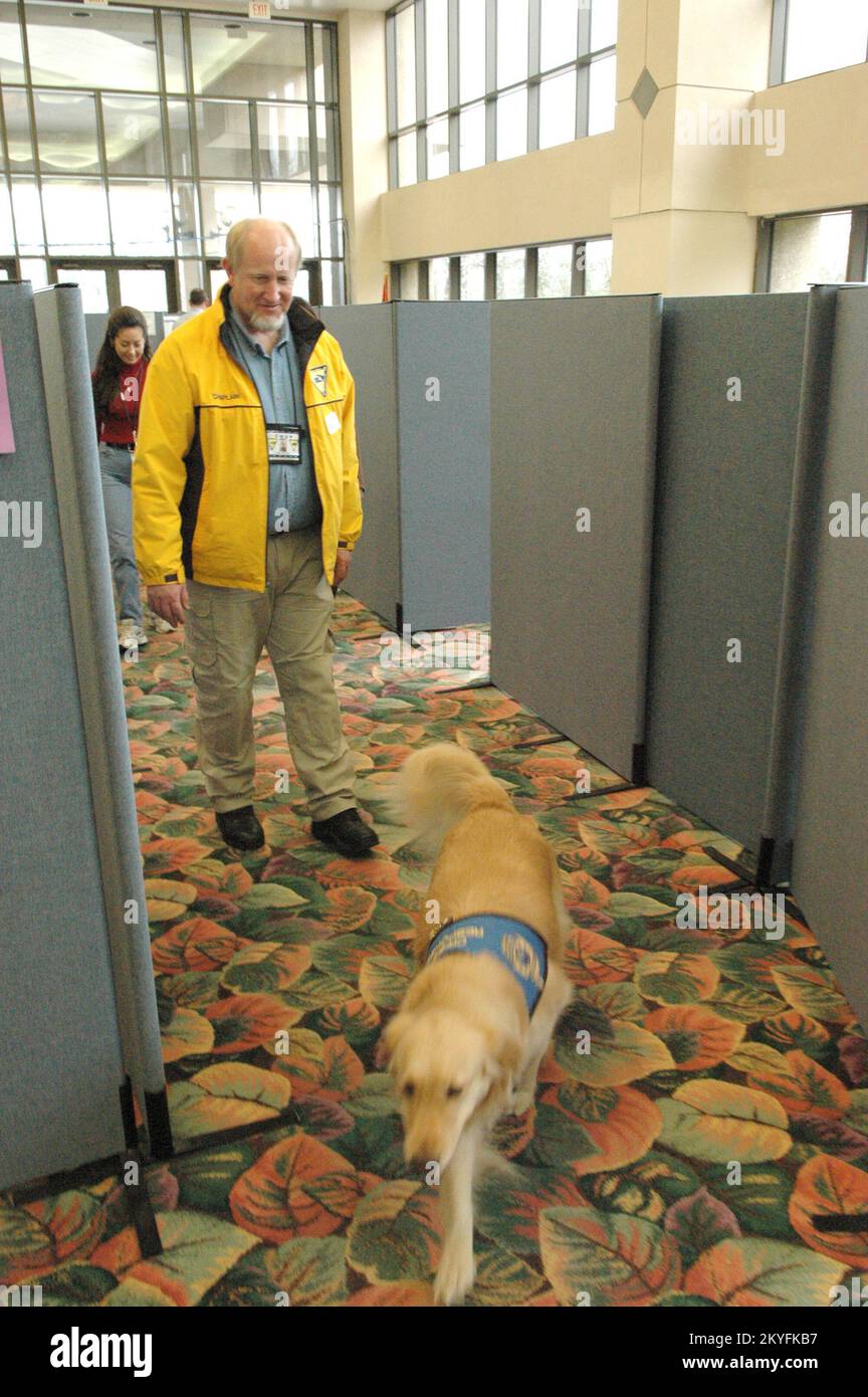 Hurricane Katrina, Biloxi, Miss., February 20, 2006 -- Chaplain Ralph Buchhorn and his Crisis Response K-9 Chaplain Georgie visit FEMA personnel at the Joint Field Office in Biloxi. Chaplain Buchhorn and Georgie have been visiting residents affected by Hurricane Katrina. Mark Wolfe/FEMA Stock Photo