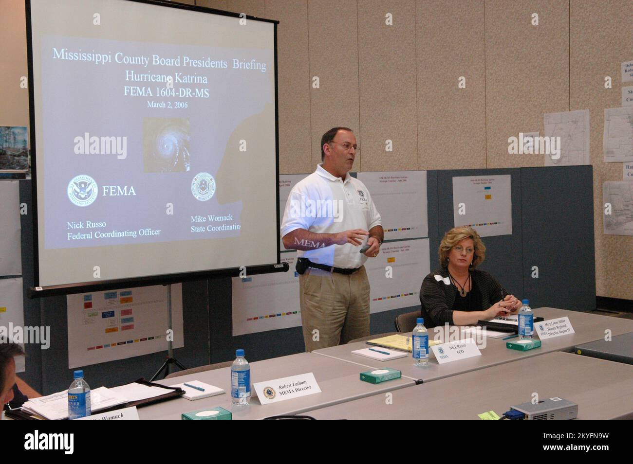 Hurricane Katrina, Biloxi, Miss., March 2, 2006 -- FEMA Federal Coordinating Officer (FCO) Nick Russo (left) addresses the officials from the six southernmost Mississippi counties as FEMA Region IV Deputy Director Mary Lynne Miller looks on. Mr. Russo is working to keep the officials up to date on the FEMA recovery efforts. Mark Wolfe/FEMA Stock Photo