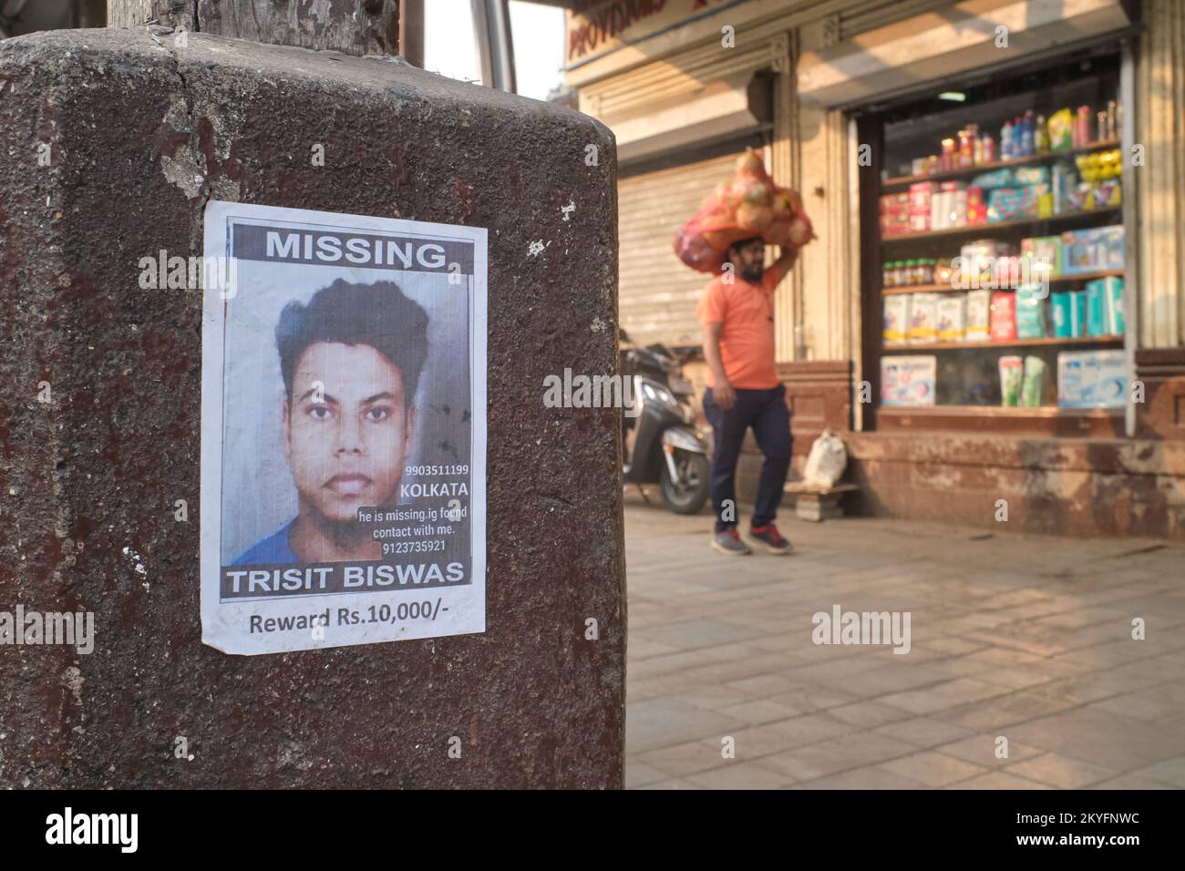 A 'Missing Person' poster depicting a young man outside Byculla Station in Mumbai, India Stock Photo