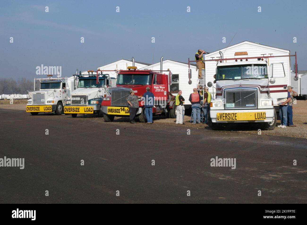 Hurricane Katrina, HOPE, AR, March 10, 2007 -- Tractor trailer rigs prepare to tow four of 23 mobile homes that are heading to Dumas, AR to serve as emergency housing for those recently affected by tornadoes. FEMA Stock Photo