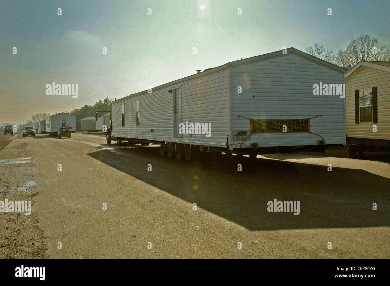 Hurricane Katrina, HOPE, AR, March 10, 2007 -- Several more of the 23 mobile homes that are heading to Dumas, AR to serve as emergency housing for those recently affected by tornadoes, begin their four hour journey across the state. FEMA Stock Photo