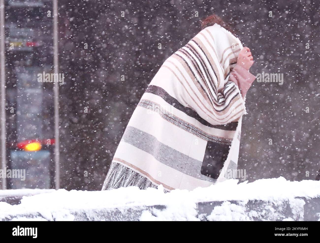 New York, United States. 07th Jan, 2022. Pedestrians walk through New