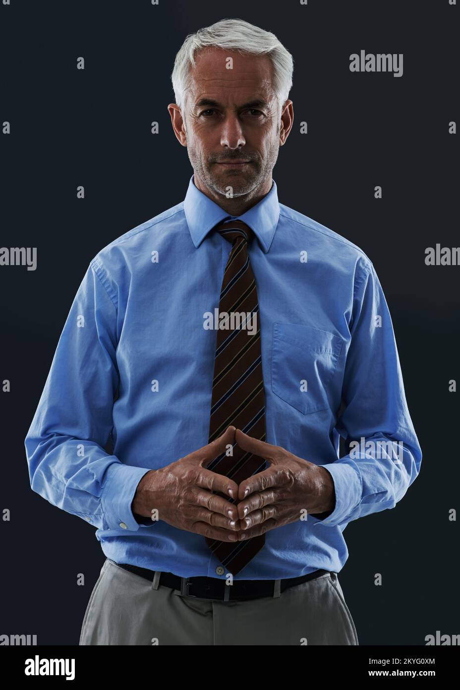Coming up with a winning strategy. A mature man looking at the camera in a thoughtful pose. Stock Photo
