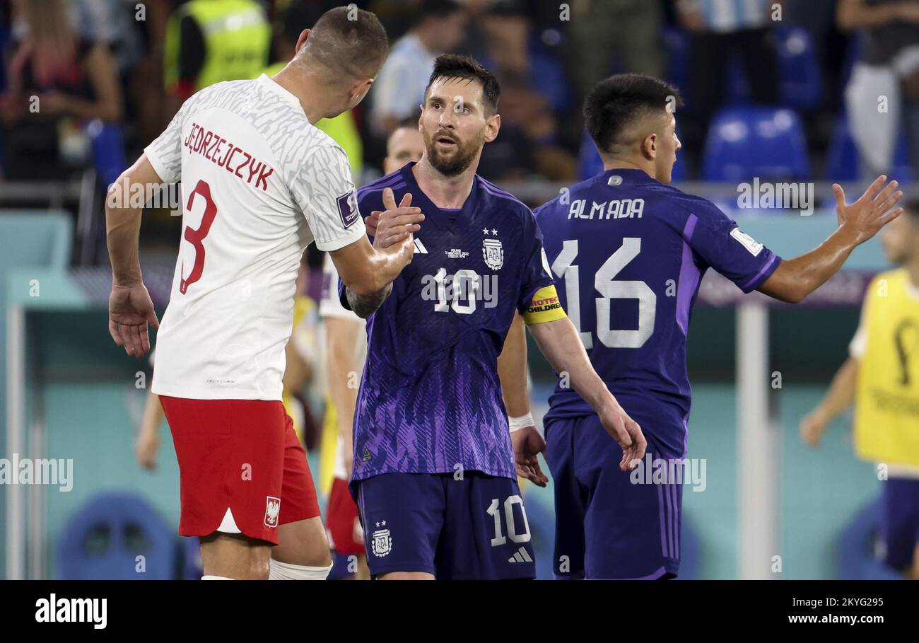 Lionel Messi of Argentina salutes Artur Jedrzejczyk of Poland (left) following the FIFA World Cup 2022, Group C football match between Poland and Argentina on November 30, 2022 at Stadium 974 in Doha, Qatar - Photo: Jean Catuffe/DPPI/LiveMedia Stock Photo