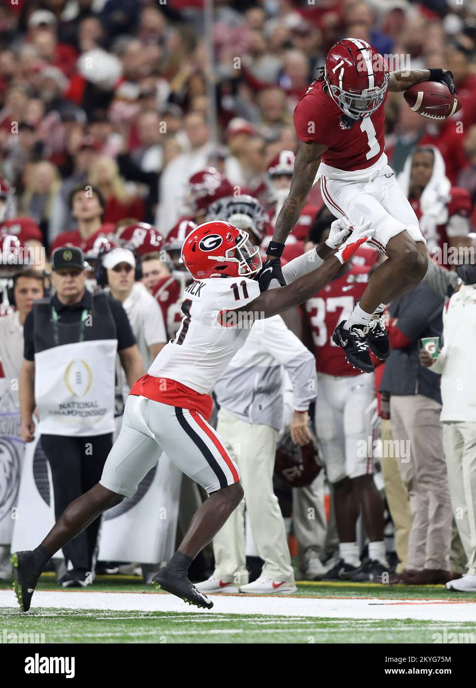 Alabama Crimson Tide wide receiver Jameson Williams (1) leaps above Georgia Bulldogs defensive back Derion Kendrick (11) for a first down during the first half of the 2022 NCAA National Championship football game at Lucas Oil Stadium in Indianapolis, Indiana, on Monday, January 10, 2022. Photo by Aaron Josefczyk/UPI Stock Photo