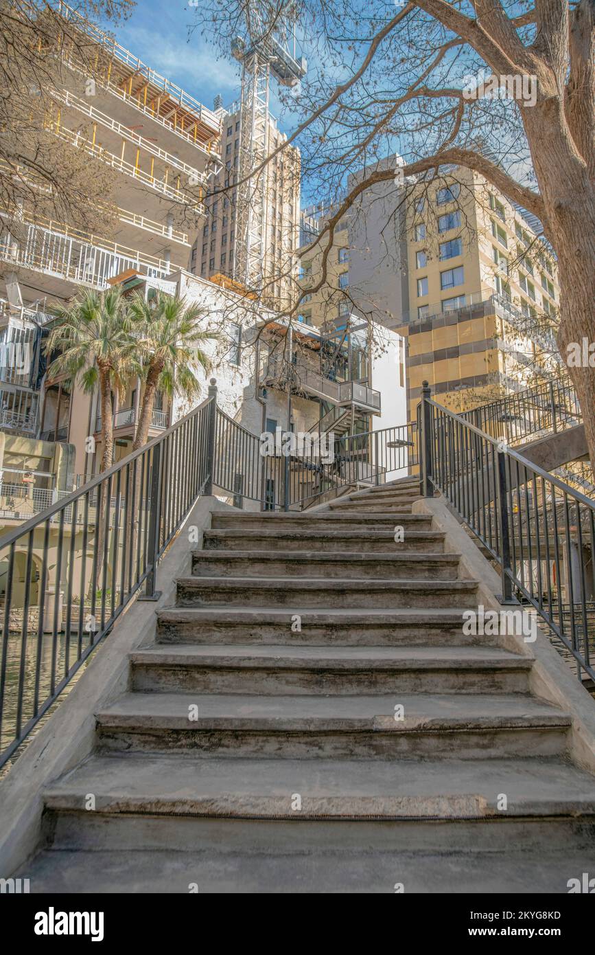 Stairs with railings going up a bridge in San Antonio River Walk in ...