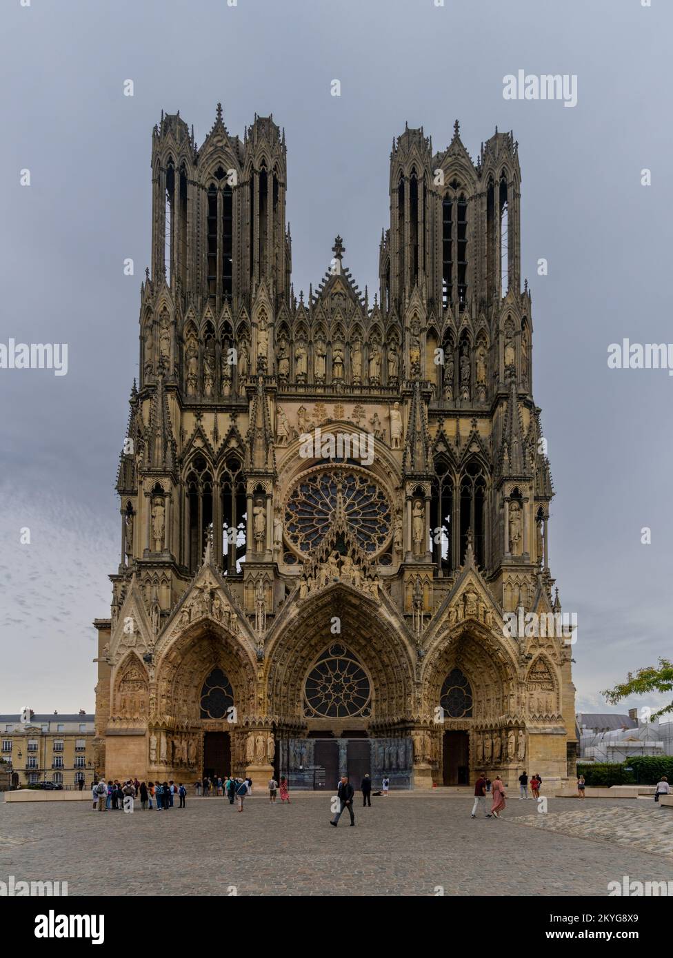 Reims, France- 13 September, 2022: view of the west facade exterior and two spires of the historic Reims Cathedral Stock Photo