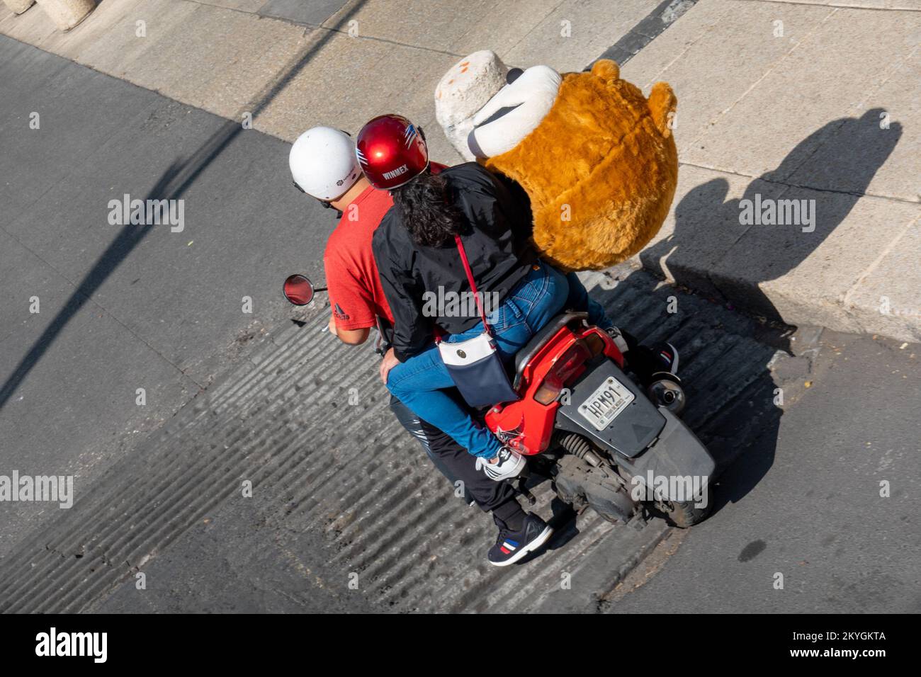Street Life, Mexico city Giant Teddy Bear on Motorcycle Stock Photo
