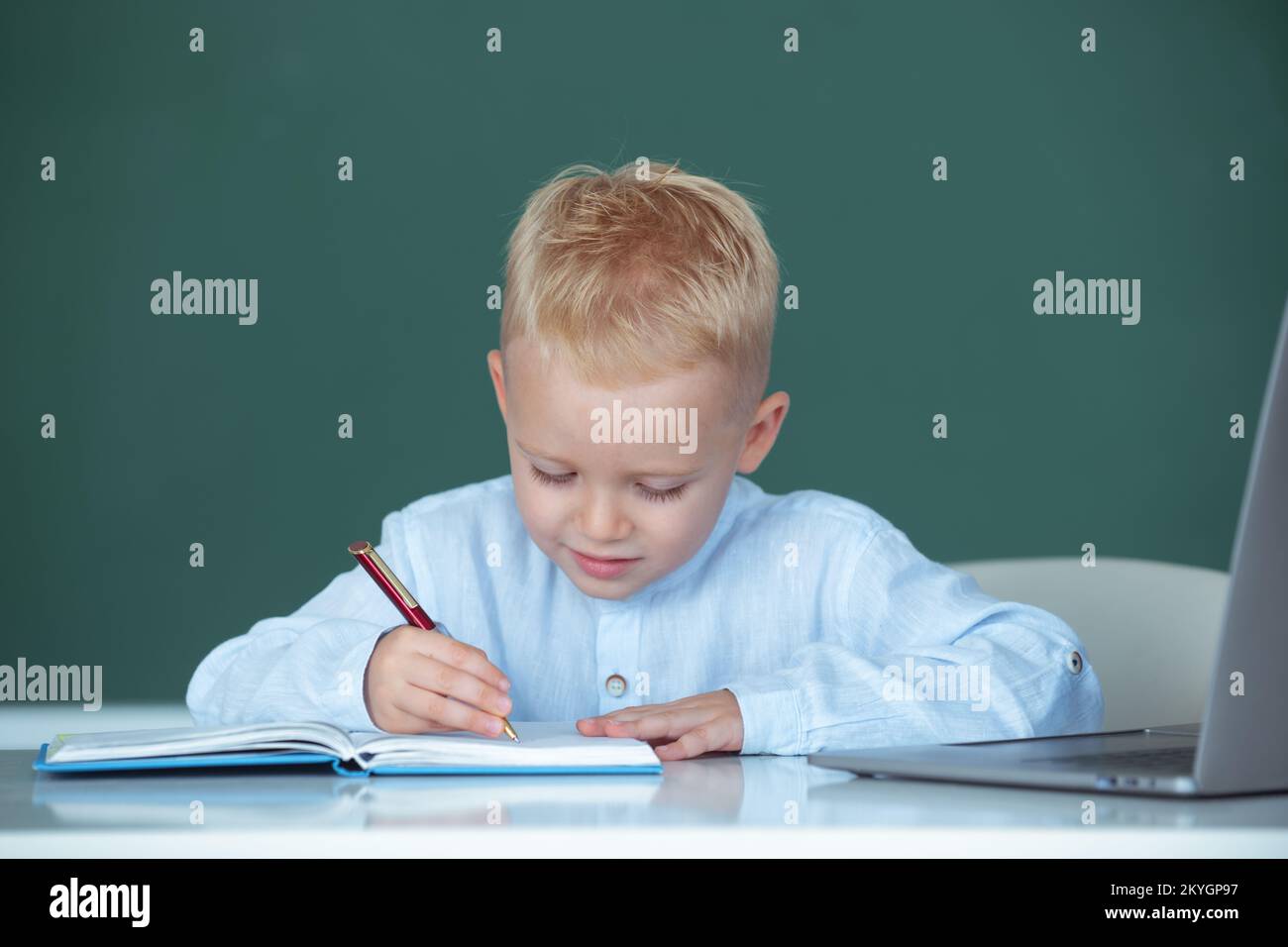 Portrait of funny pupil of primary school study in classroom at ...