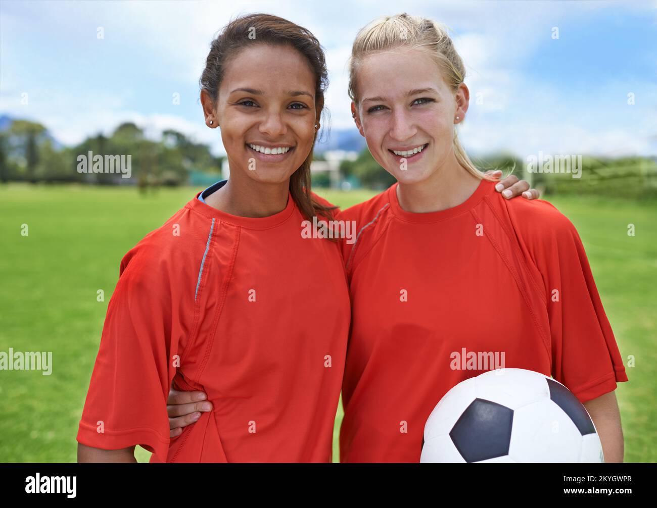 Teammates and best friends. Portrait of two young female soccer players