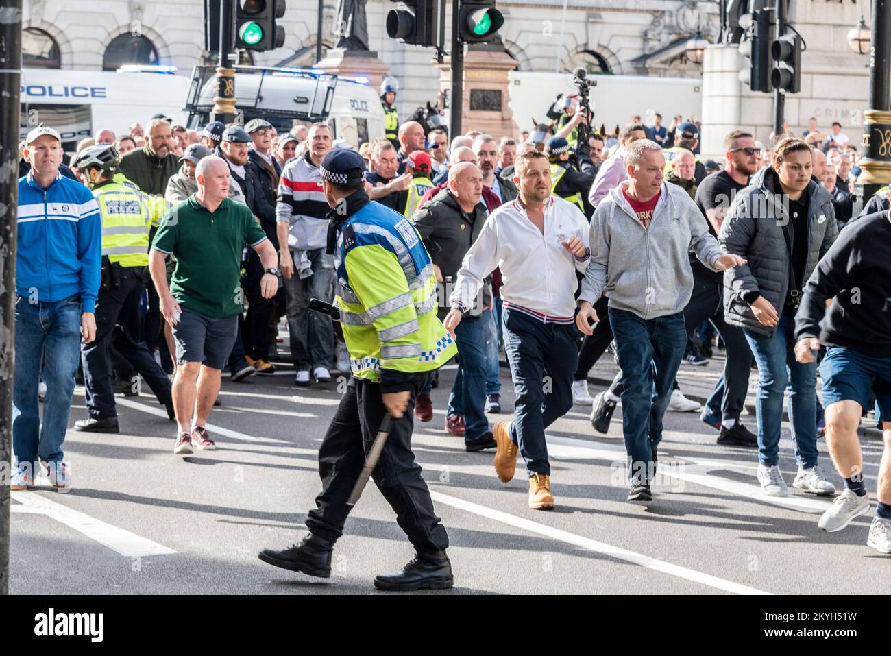 Democratic Football Lads Alliance, DFLA, march in London, UK, in a protest demonstration. Breaking through police cordon. Lone police officer Stock Photo