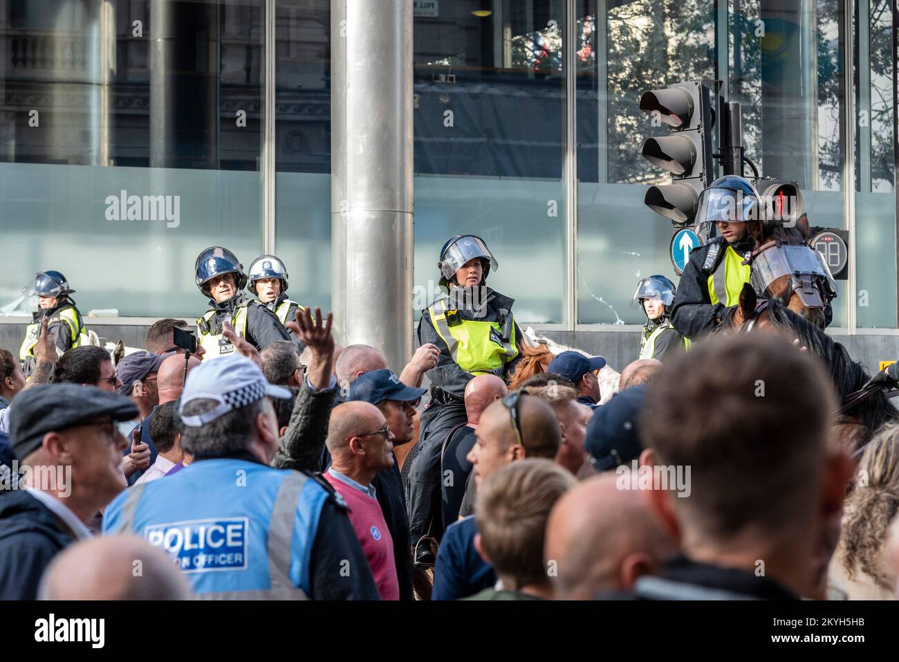 Democratic Football Lads Alliance, DFLA, march in London, UK, in a protest demonstration. Breaking through police cordon. Mounted police holding line Stock Photo