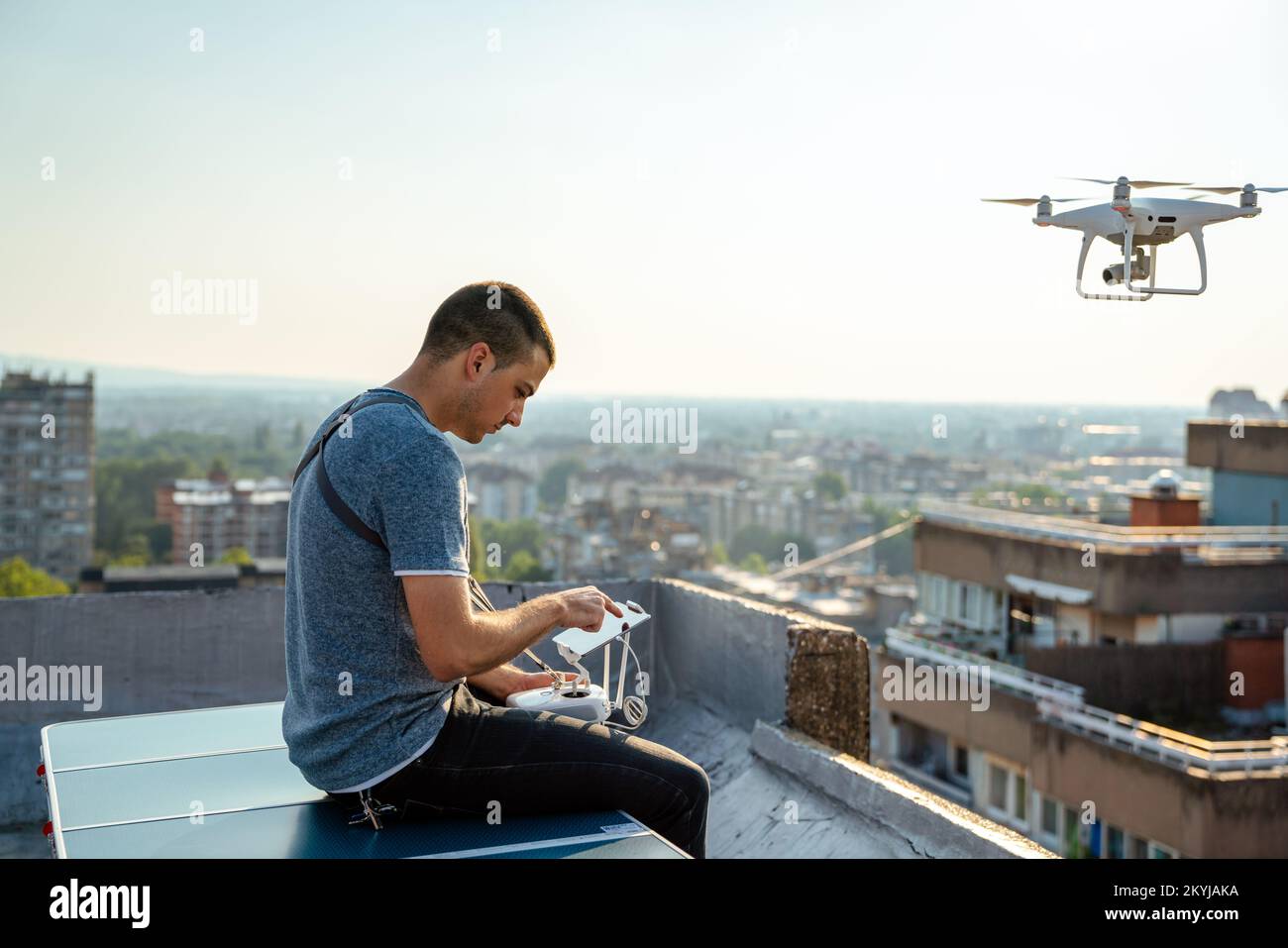 Man with drone flying at the city Stock Photo