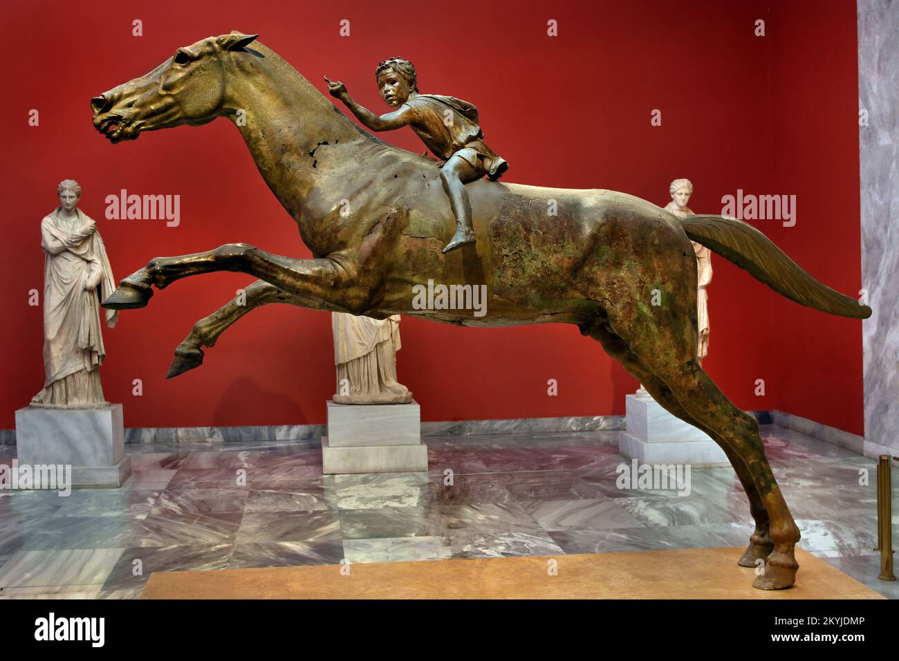 The Jockey of Artemision  large Hellenistic bronze statue, young boy riding a horse, dated to around 150–140 BC,  bronze statue from Ancient Greece , Greek sculpture of a racehorse, saved from destruction when it was lost in a shipwreck in antiquity,  discovered in the twentieth century, Dedicated to the gods.  National Archaeological Museum in Athens. Stock Photo