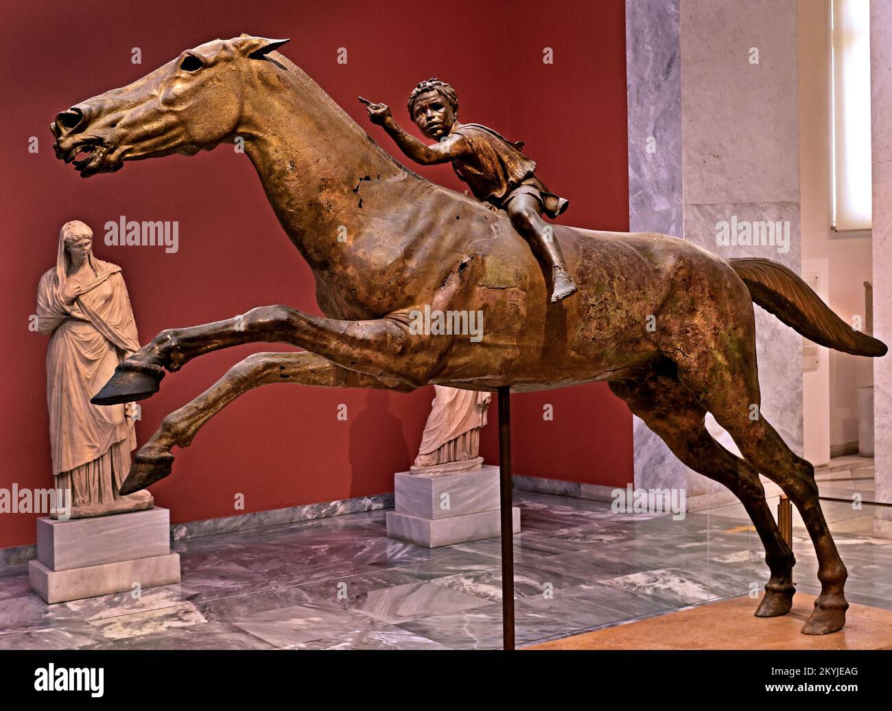 The Jockey of Artemision  large Hellenistic bronze statue, young boy riding a horse, dated to around 150–140 BC,  bronze statue from Ancient Greece , Greek sculpture of a racehorse, saved from destruction when it was lost in a shipwreck in antiquity,  discovered in the twentieth century, Dedicated to the gods.  National Archaeological Museum in Athens. Stock Photo