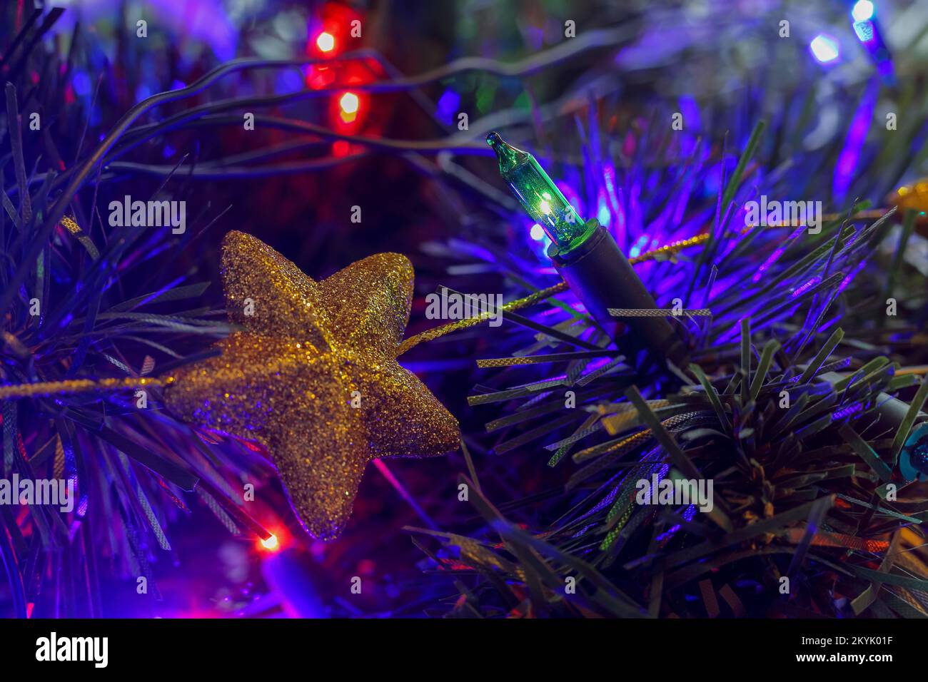 Star-shaped Christmas baubles hanging on a Christmas tree in Poland Stock Photo