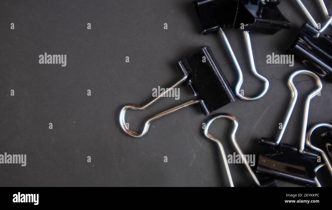 black paper clip on black background Stock Photo Alamy