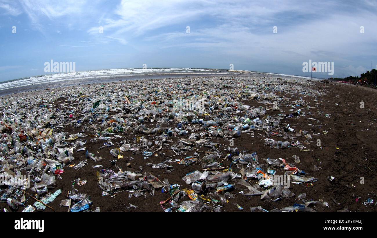Plastic pollution and garbage from the Indian Ocean collects on the beach in Bali Indonesia Stock Photo