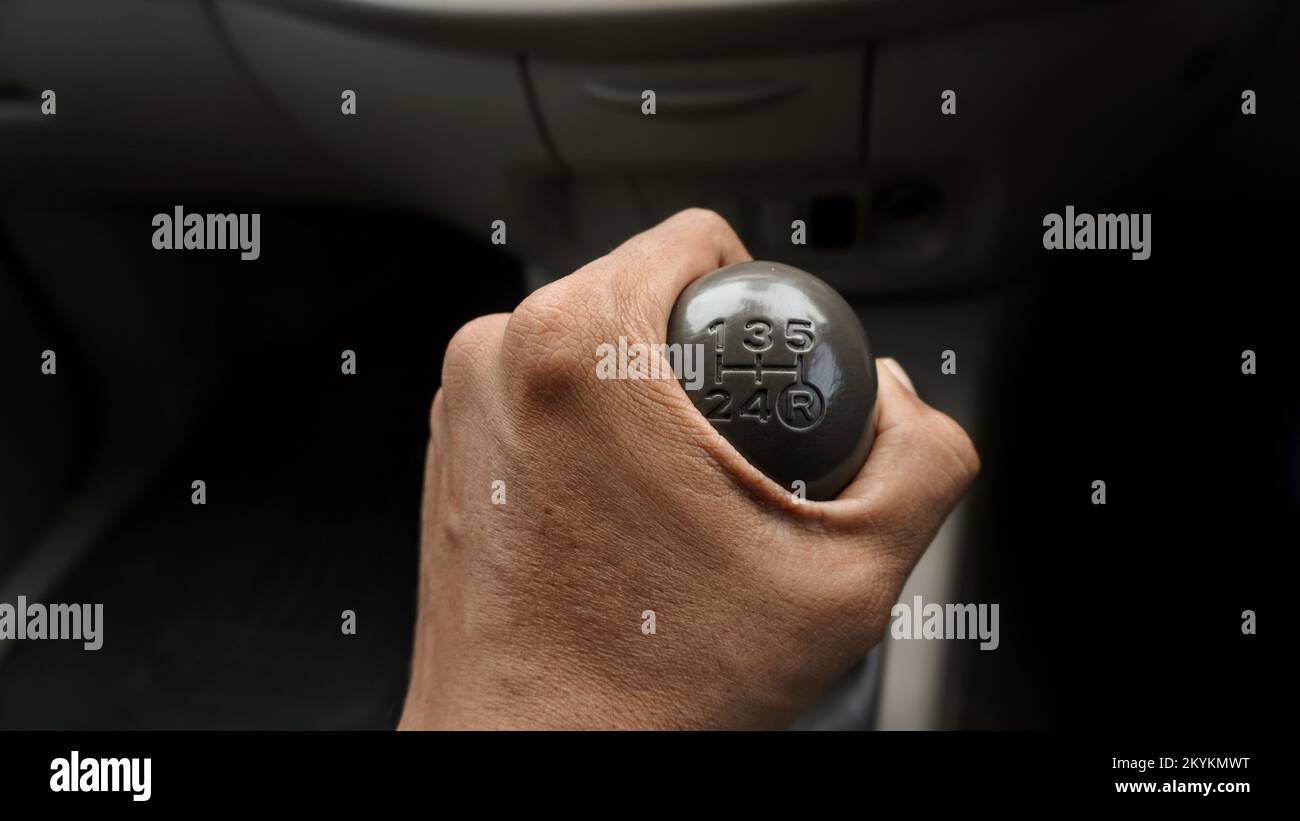 Close up the hand holding the car gear switch vehicle part Stock Photo