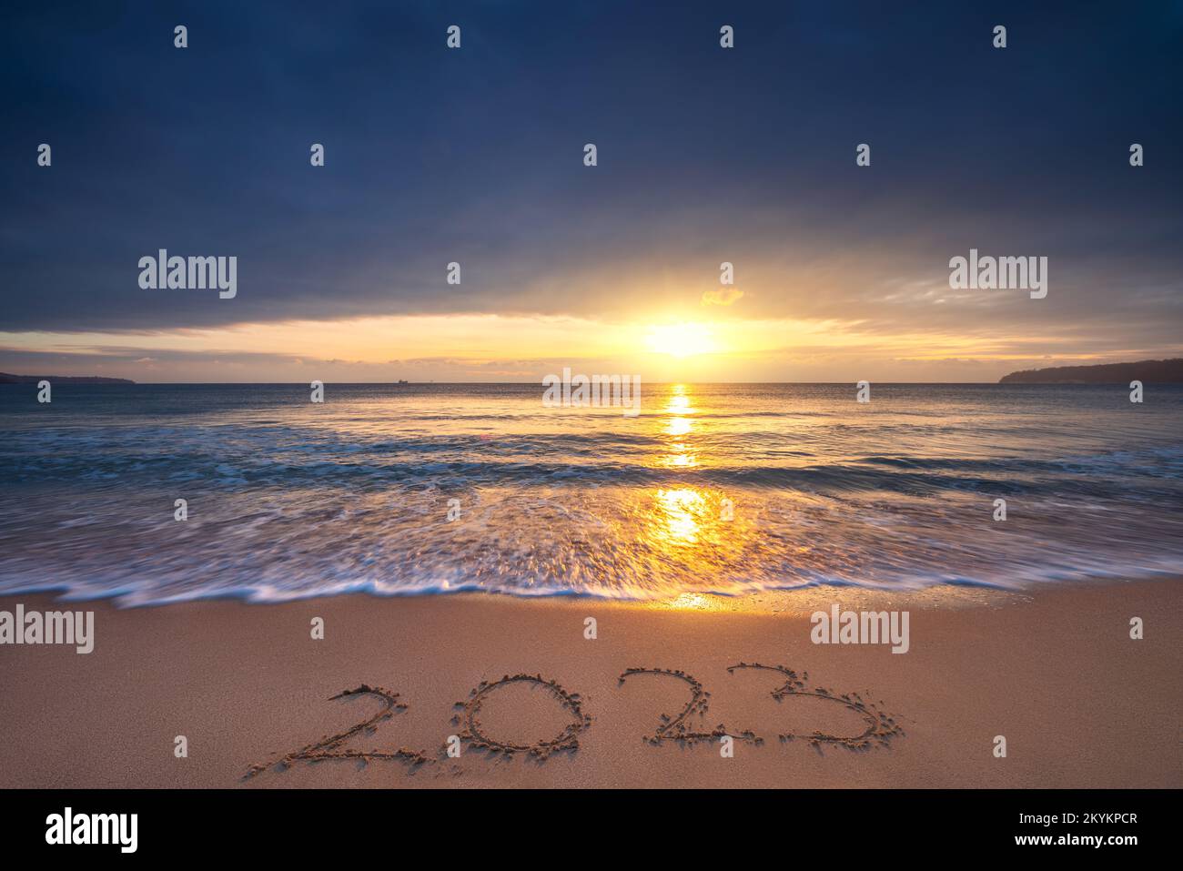 Happy New Year 2023 sea sunrise on the beach shore concept Stock Photo
