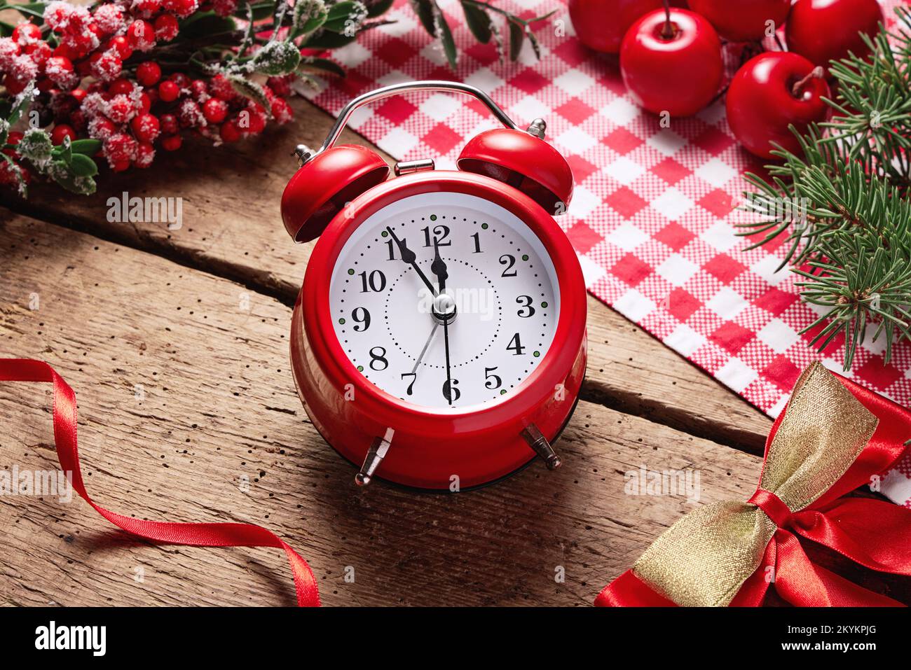 Christmas alarm clock counting minutes till midnight on holidays background. Concept of coming Xmas and New Year, holiday sales. Space for text, banne Stock Photo