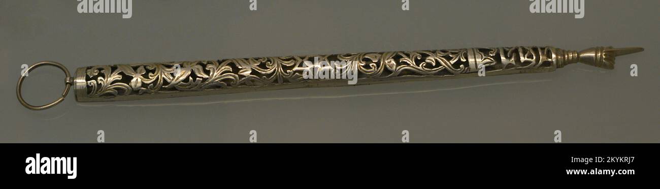 Pointer (moré or yad) of openwork silver with vegetal motifs and Hebrew inscription. Used to follow the reading of the Torah (Jewish Law). Dated in the 20th century. Made in Morocco. Sephardic Museum. Toledo. Castile-La Mancha. Spain. Stock Photo