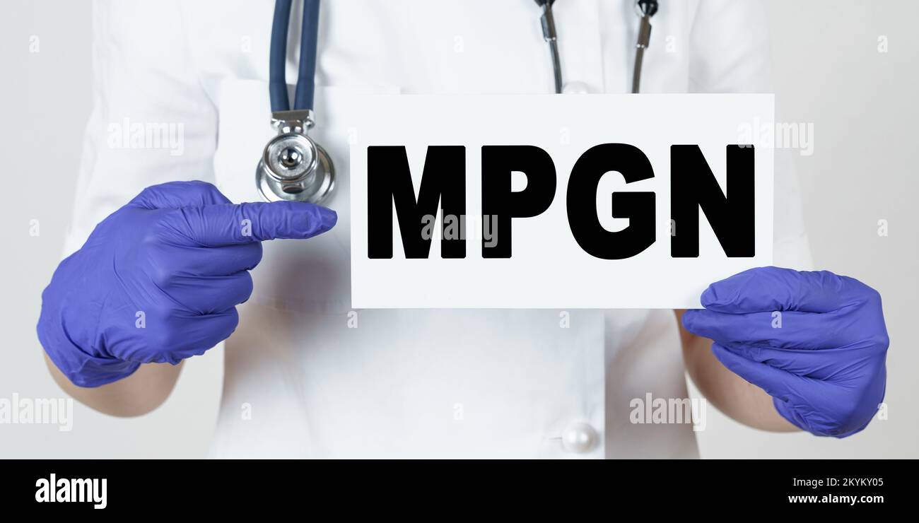 Medicine and health concept. The doctor points his finger at a sign that says - MPGN. membrane proliferative glomerulonephritis Stock Photo
