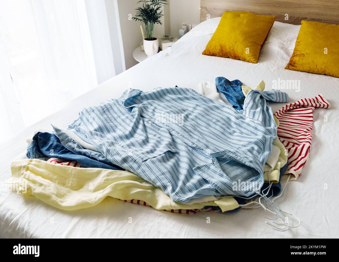 Pile of clothes on hangers Stock Photo Alamy