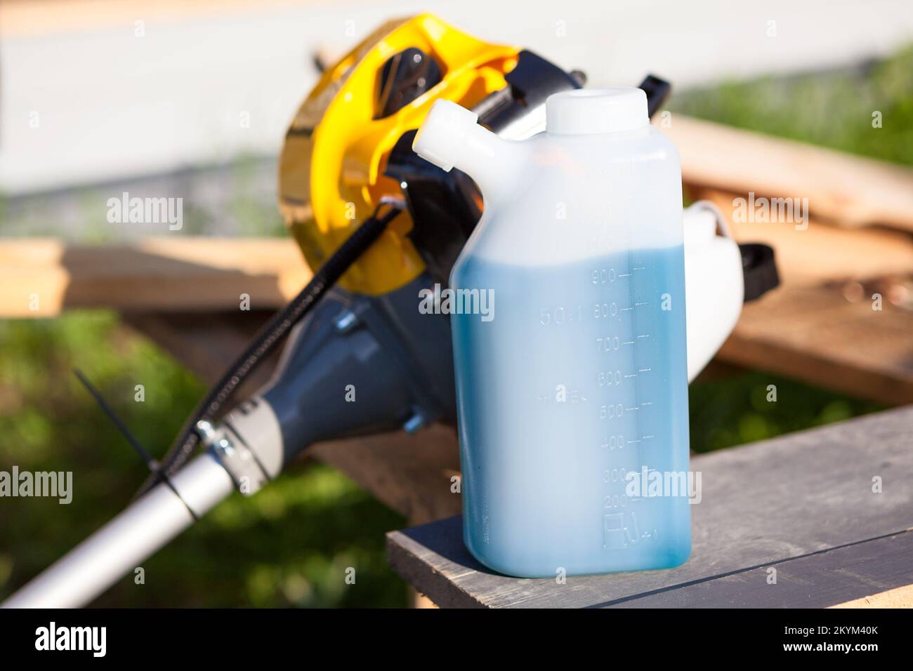 A 2stroke engine lubricating oil is mixed with petrol, lawn trimmer is