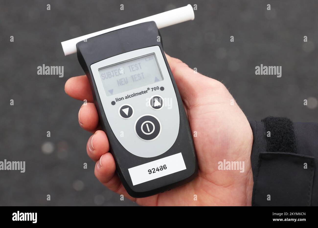 A police officer holding a breathalyser at the launch of the 2022/23 police winter anti-drink/drug drive operation on Sydenham Road in Belfast. Picture date: Thursday December 1, 2022. Stock Photo