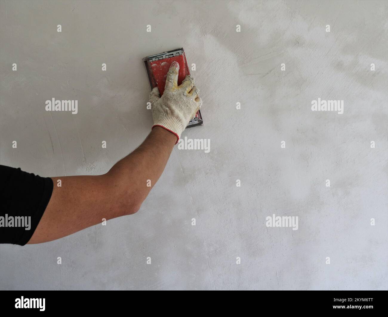 peeling unevenness on a putty wall, grouting a freshly plastered wall